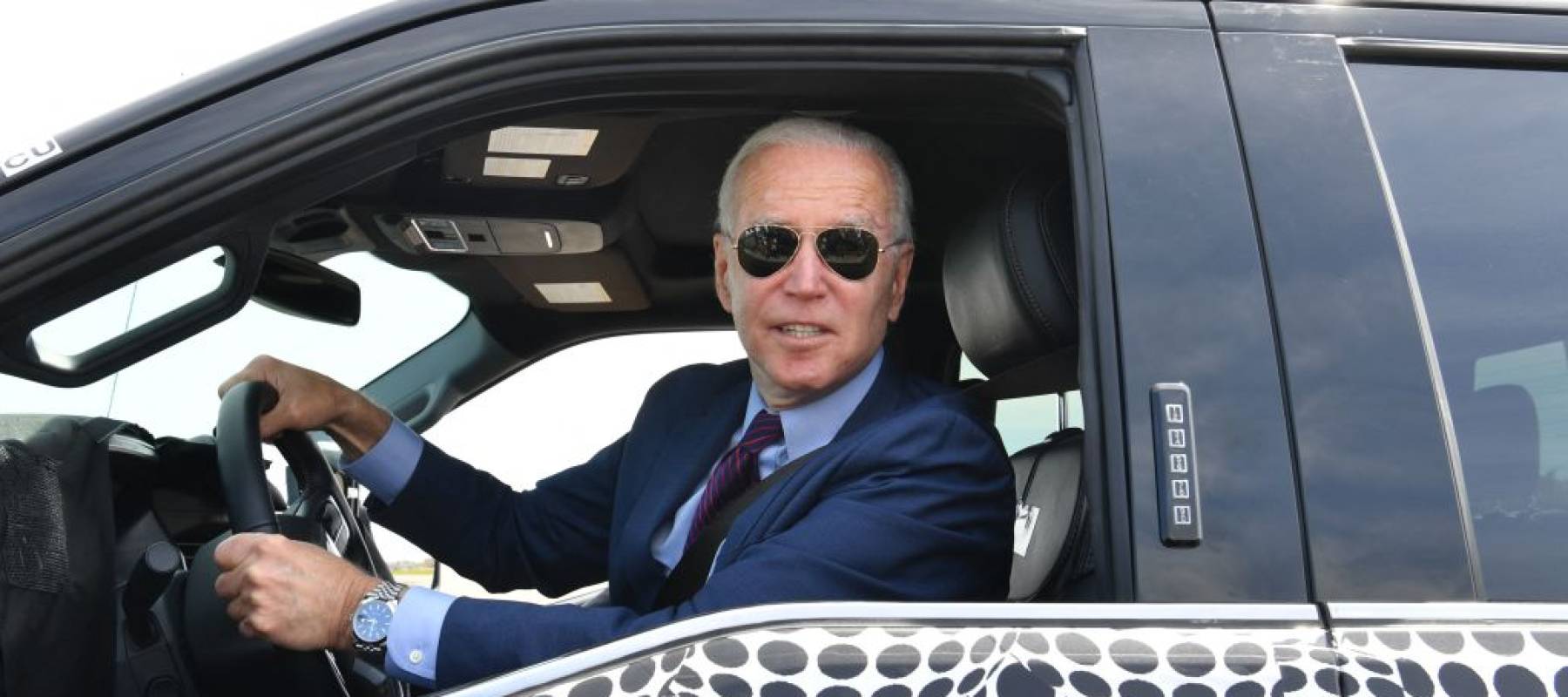 US President Joe Biden drives the new electric Ford F-150 Lightning at the Ford Dearborn Development Center in Dearborn, Michigan on May 18, 2021